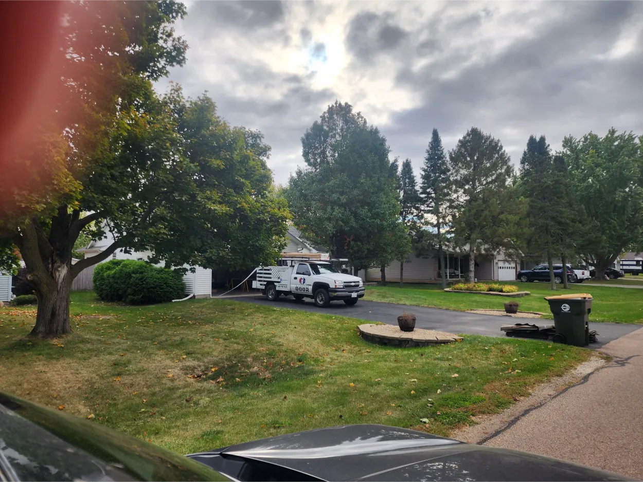 Company car parked in the driveway.