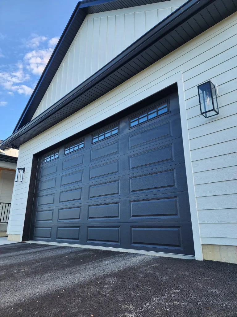 Close up of a sleek black residential garage door.