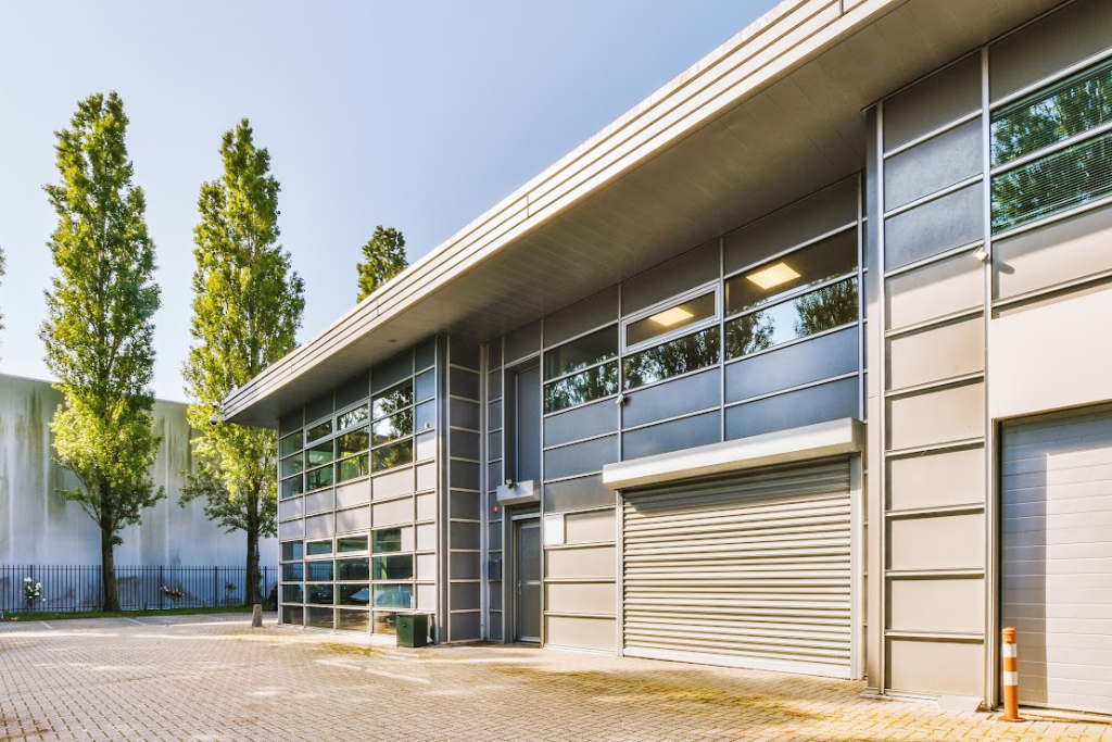 A modern commercial building with garage doors.