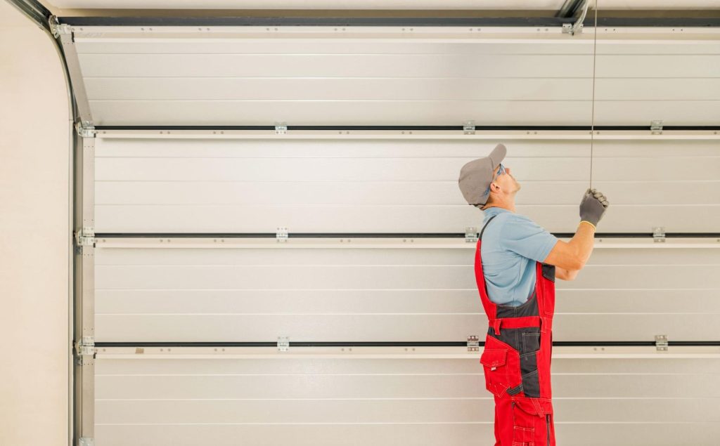 A man checks the newly installed garage doors.